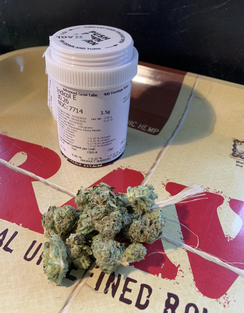 Picture of marijuana flower on a tray. Marijuana is AGL indicol E