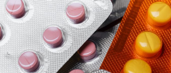 A pile of pills in blister packs