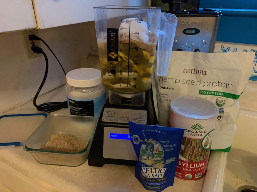 Smoothie ingredients and blender on the kitchen counter.