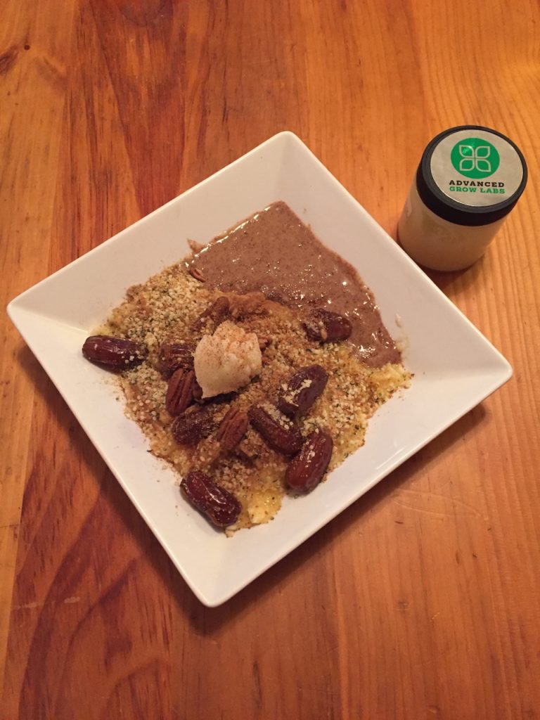 A bowl of mashed bananas topped with marijuana-infused coconut oil, dates and hemp seeds.