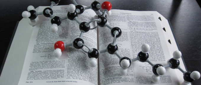 A 3-D molecular model of THC sitting on top of the Merck Index opened to the entry for THC.